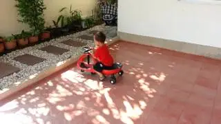 Tommy playing with his car, being a bit naughty