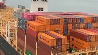 Container logistics. Shipping cargo by sea and ocean. Container ship. IEC.