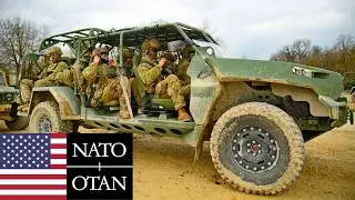 US Army, NATO. Soldiers and armored vehicles during military training in Germany.