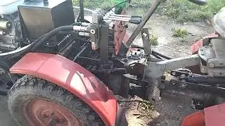 Mini tractor TZ-14, modernization, installation of a front blade, hydraulic equipment.