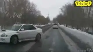 Subaru Impreza slides on icy road