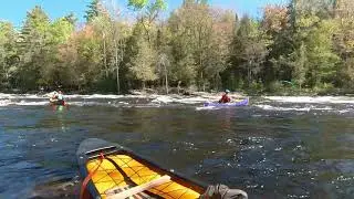 Performing a boat-over-boat rescue while going down Chalet Rapid on the Middle Madawaska River.