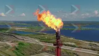 Clouds of fire from a pipe at a gas plant
