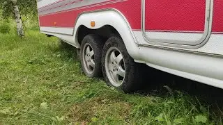 Torsion bar suspension for a caravan trailer. Increases ground clearance.