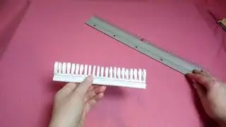 A handy little thing: a drawstring comb for a knitting machine, made by hand.