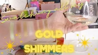 Swatching all my gold eyeshadows over a Sav Blanc.. oh la la!
