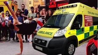 Street Performer Nearly Gets Hit By Ambulance