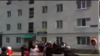 Mother throws children from fiery building in Russia