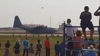 Lockhead C130 Hercules dropping cargo & crew and then taking off