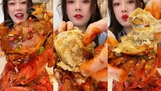 The cute girl eating big crab of seafood # 308