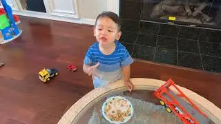 Dommy Eating Cheerios and Gerber Puffs