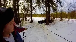 The pulley system pulled the car out of the snowdrift.