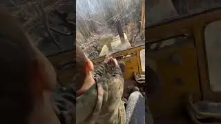 a little boy drives a bulldozer