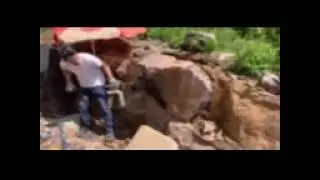 Removing overburden from a freshly found Amethyst vein.