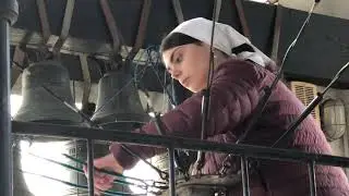 Girl at belltower of Danilov monastery in Moscow, Russia