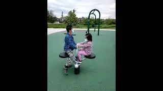 James Cheng and Jacqueline Cheng at park children playground seesaw