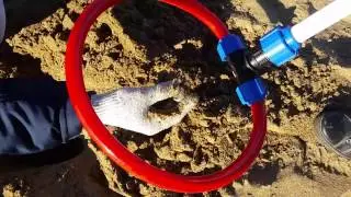 Metal detector Pirate on the beach river Volga