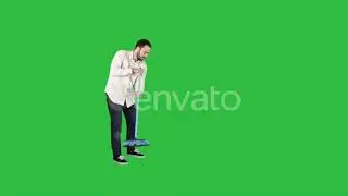Young man cleaning floor with brush on a Green Screen, Chroma Key. | Stock Footage - Videohive