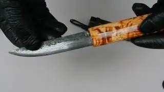 Средний якутский нож из дикого дамаска и сувели.