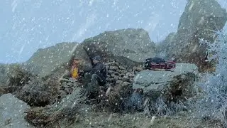 Caught in a winter storm and thick fog/Building a safe and warm shelter under a giant rock/Camping