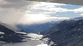 Scenic dynamic flight into the snowy Italian alps