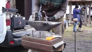 Here the farrier was doing some fine adjustments before fitting the shoe. 4/