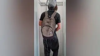 Skater taking a shower fully clothed
