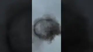 Просто кольцо черного дыма в небе