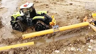RC Tractors lay pipes for water to construction site