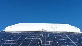 clearing snow off of my off grid solar array