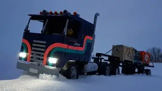 Lego truck driving through snow while synth music plays
