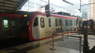 LRT-1 4G Set 12 departing Fernando Poe Jr. station ft... an unknown trainspotter