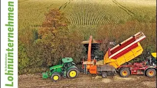 Corn overloaded with snowblower - contractor in operation