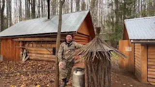 A log cabin with its own well. Preparing for a harsh winter.