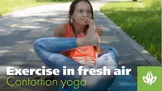 Exercise in the fresh air. Yoga by Natalia Chistyakova. Left behind head. Contortion & stretching.