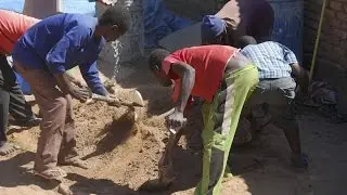 Hand Mixing to Make Compressed Earth Blocks