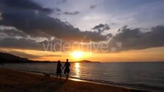 Stock Footage - Honeymoon Couple at Dramatic Sunset | VideoHive