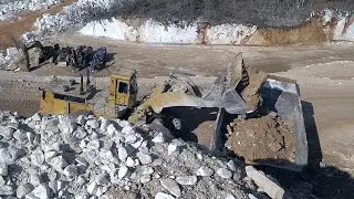 CAT 992 Earthmover Loads Dump Truck in Marble Quarry