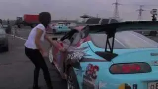 Toyota Supra Drifting unbuttons woman's chest