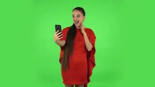 Pretty Young Woman Is Talking for Video Chat Using Mobile Phone and Rejoice  Green Screen