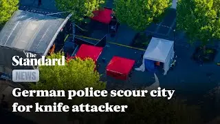 German police scour city for knife attacker who killed three at festival