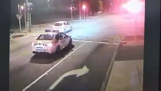 Driver goes through red light in front of a marked police car! So dumb