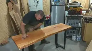 Adding finishing touches to live edge Cherry table